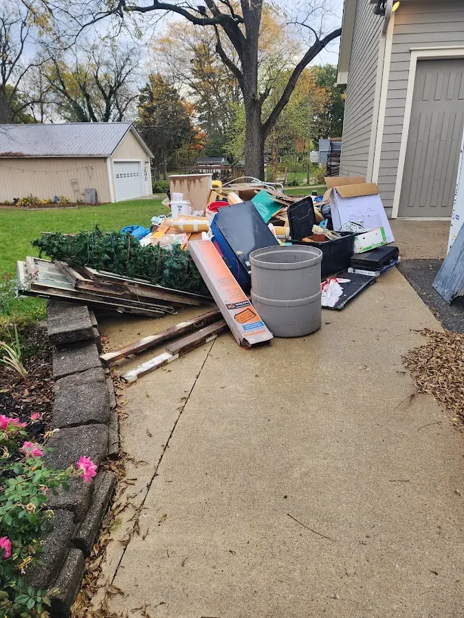 Dumpster being loaded with debris for Demolition Dumpster Rental in Hayfork